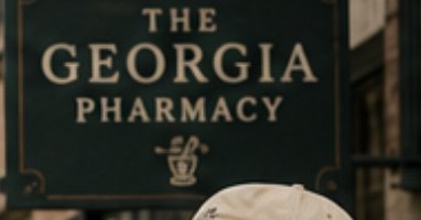 The Georgia Pharmacy hanging sign outside the storefront